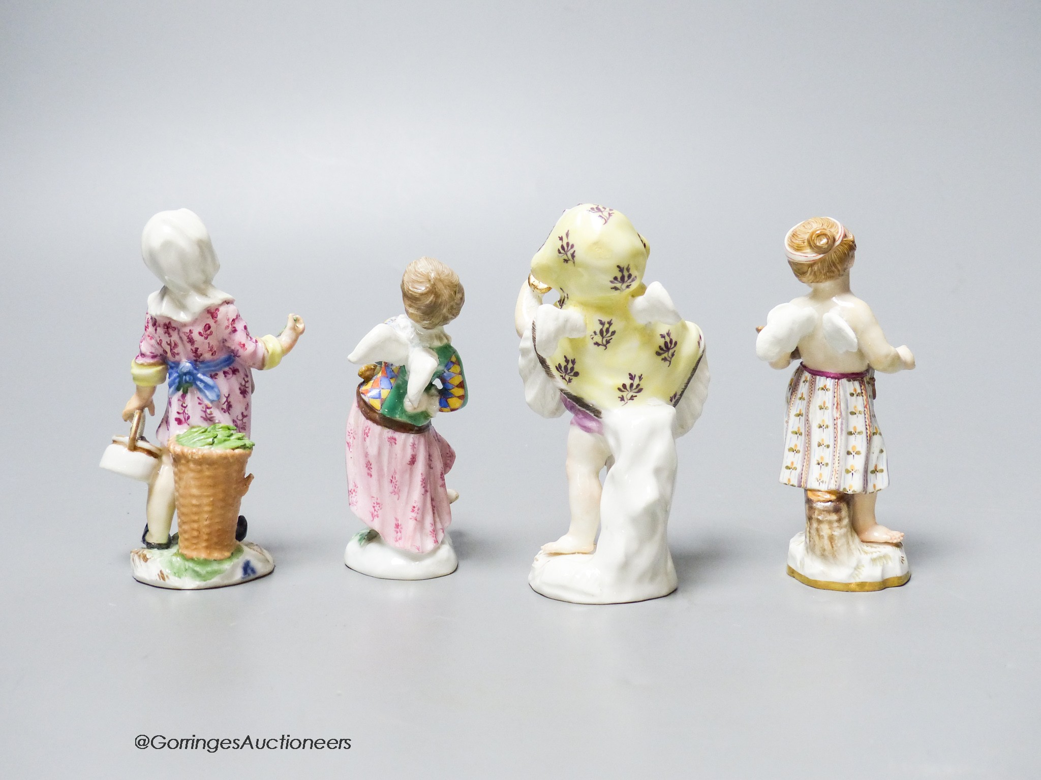 Two mid 18th century Meissen figures of Cupid in disguise and two similar 19th century figures, tallest 9cm